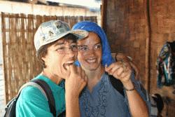 Therese and Veronica sample silk worms with a smile