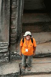 Carrol watches us climb the temples in Angkor Thom