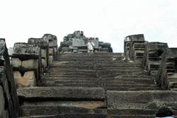 Paul climbs up an Angkor Thom temple