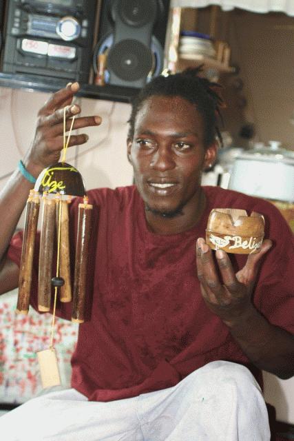 Brandon displays his crafts. Gales Point.