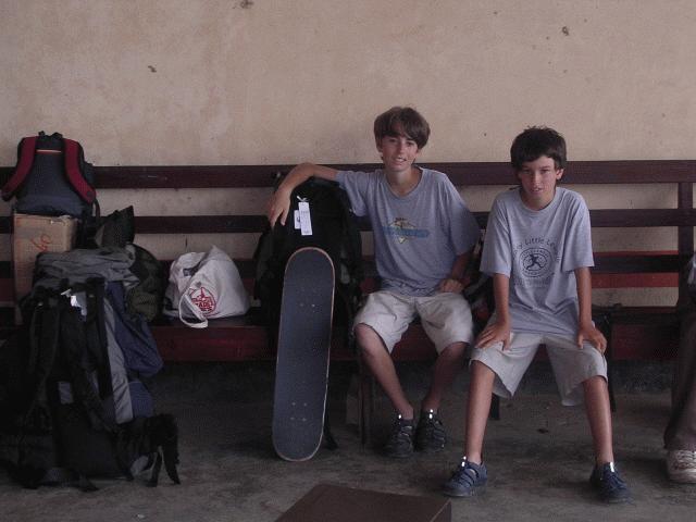 Peter and Paul wait for the south bound bus in Belize City