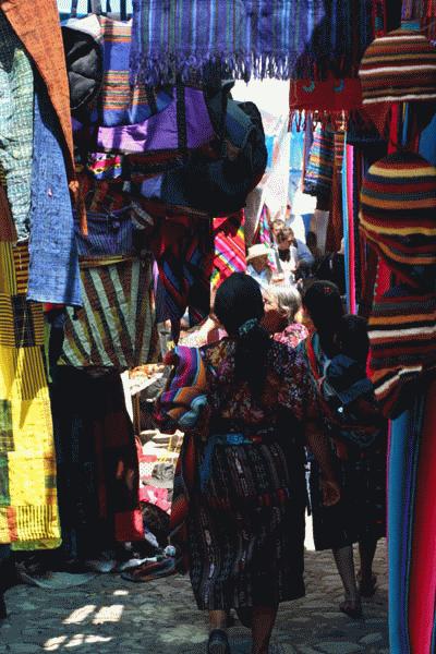 The Chichi market is a sea of vibrant colored fabrics.