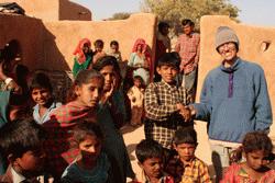 Therese greets the local village kids about 60km from Jaisalmer in a remote desert area