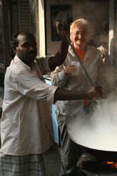 Street vendor shows Carrol how sweet lassis are made