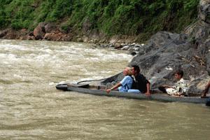 Carrol crosses the Bohorok River next to the National Park entrance.