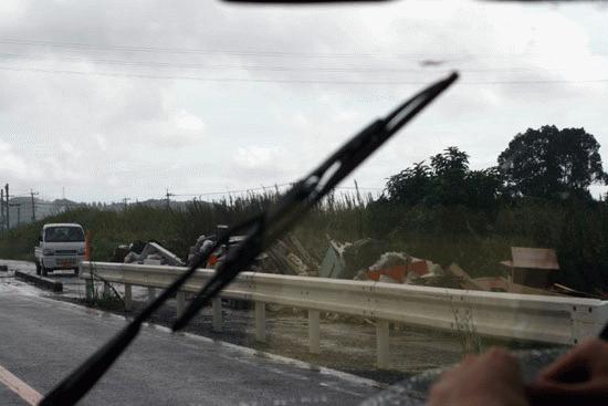 Two days after a major typhoon hit the island, we witness a massive collection of debris along many of the islands roads.