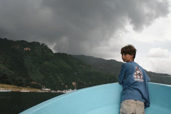 Captain Peter directs the launcha (boat) as we take an evening ride around the Lago Atitlan.