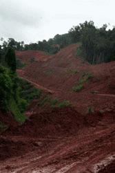 The road from Huay Xai to Luang Nam Tha looks like this.  Road construction is ever present, there are no barriers preventing fall off the shoulder of the road and the entire road is through mountainious terrain on a very slippery, red clay road.