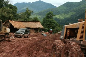 Another road obstacle high in the Lao mountains. Time to hold our breath.