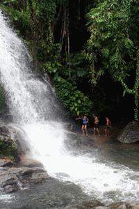 Therese, Peter and Paul maneuver around the thundrous waterfall