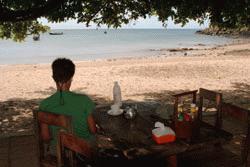 Therese does some morning journaling on the quiet beaches of Koh Lanta