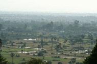 Overlooking the flat landscape of central Cambodia from the hilltop temple of Phnom Bakheng