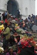 Mayan women peddle flowers on the steps of Igelsia Santos Tomos.