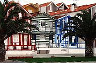 Houses along the Costa Nova beach resort maintain their traditional exterior patterns and colors.