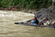 Carrol crosses the Bohorok River next to the National Park entrance.