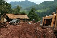 Another road obstacle high in the Lao mountains. Time to hold our breath.