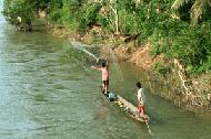 Throw net fishing along the river outside of Vang Vieng