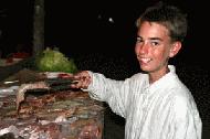 Peter displays the nightly BBQ items of Tiger Prawns, Marlin, Tuna and King Fish. Life if a Beach!