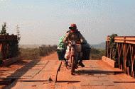 Going into traffic coming the other way is a way of life on the road to Siem Reap.