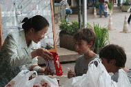 Ton's mom, Noy, provides Peter and Paul some delicious goodies from Umm! dairy in Pok Chang.