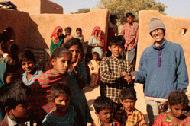 Therese greets the local village kids about 60km from Jaisalmer in a remote desert area